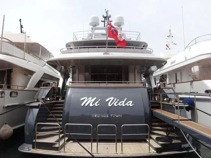 a large ship with a flag on the deck aboard TIAMAT Yacht for Sale