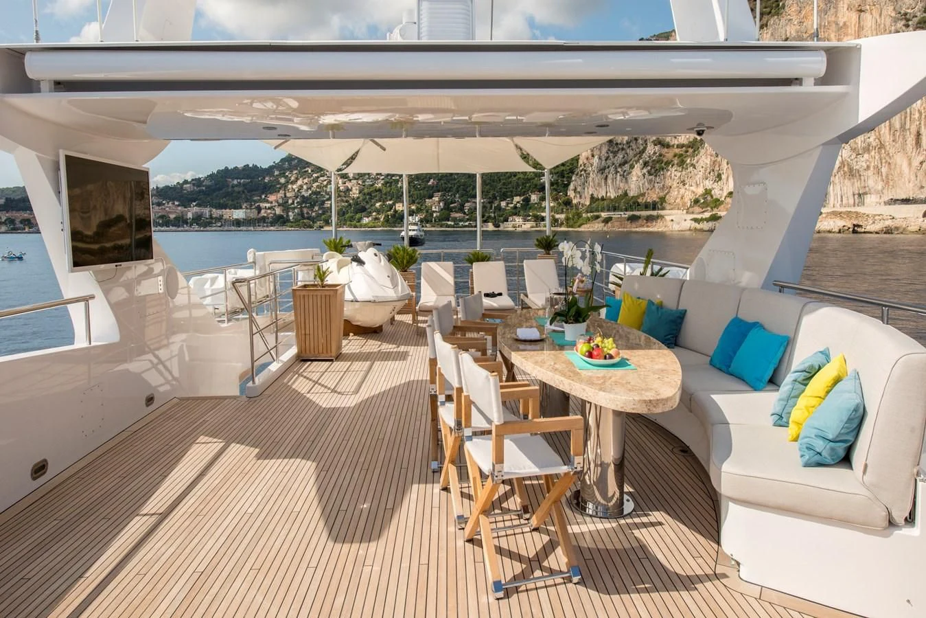 a patio with a table and chairs aboard TIAMAT Yacht for Sale