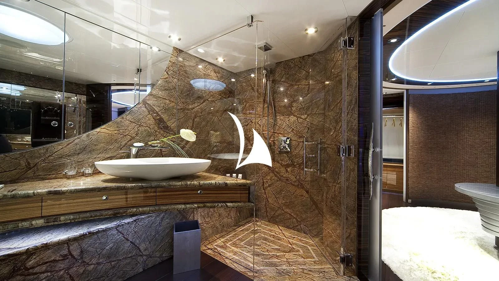 a bathroom with a sink and a large mirror aboard TIAMAT Yacht for Sale