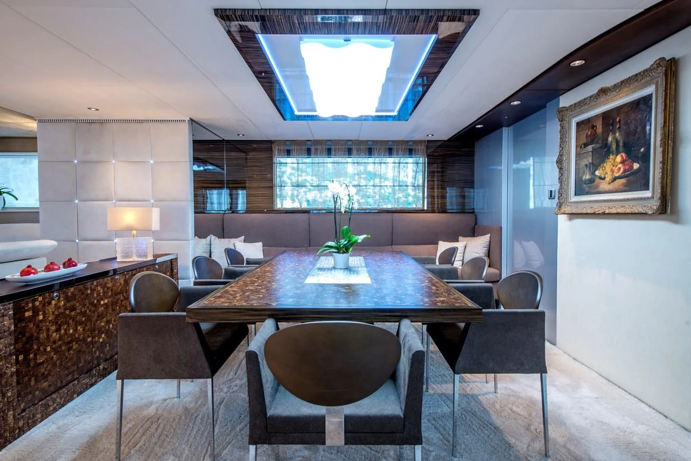 a room with a table and chairs aboard TIAMAT Yacht for Sale