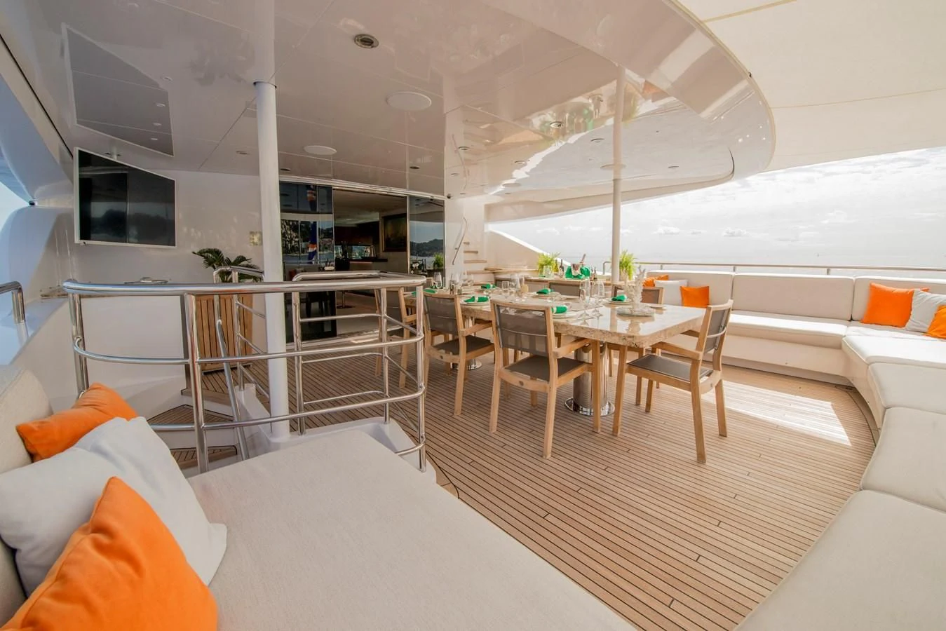 a room with a table chairs and a couch aboard TIAMAT Yacht for Sale