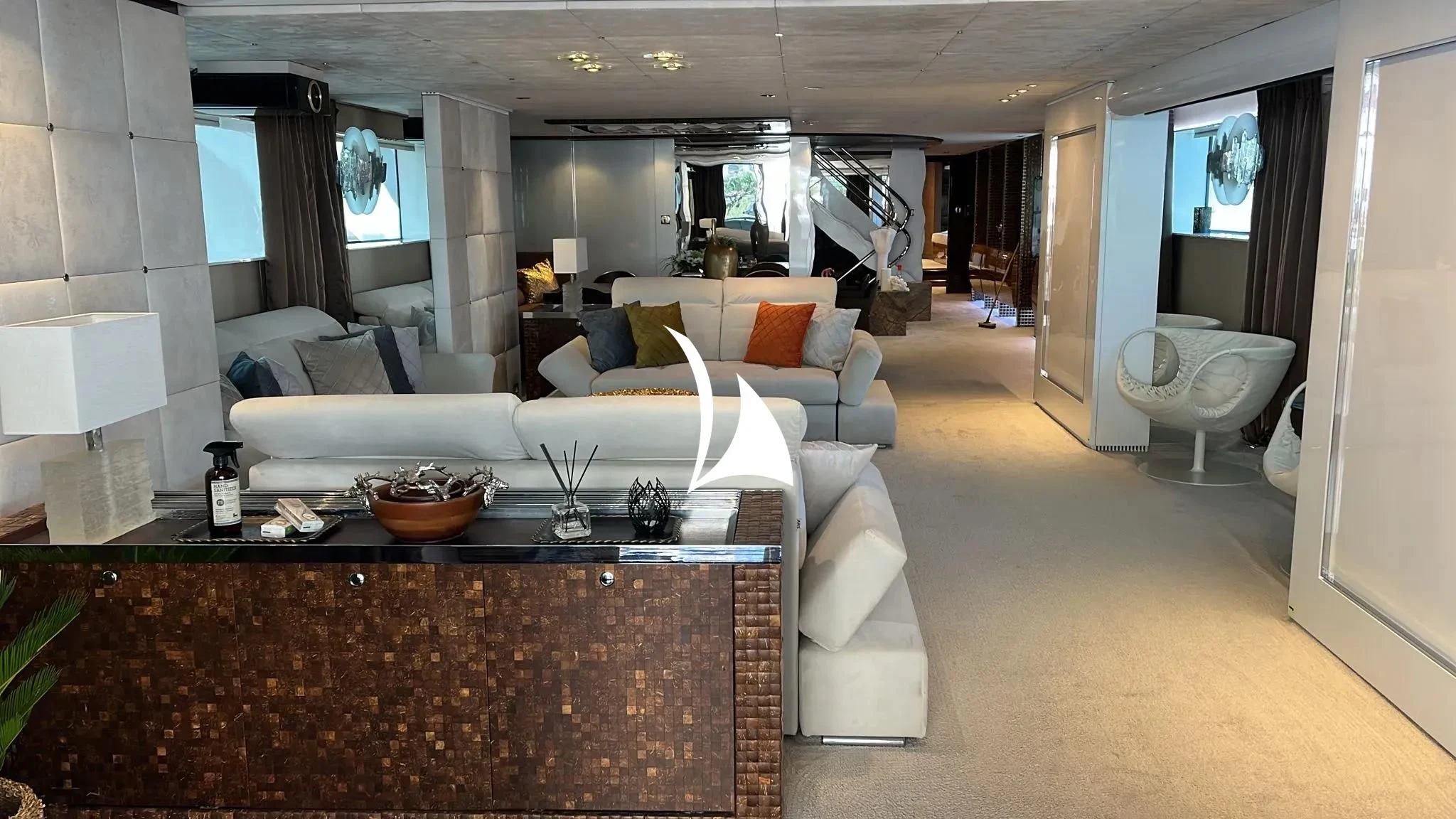 a living room with a white couch aboard TIAMAT Yacht for Sale