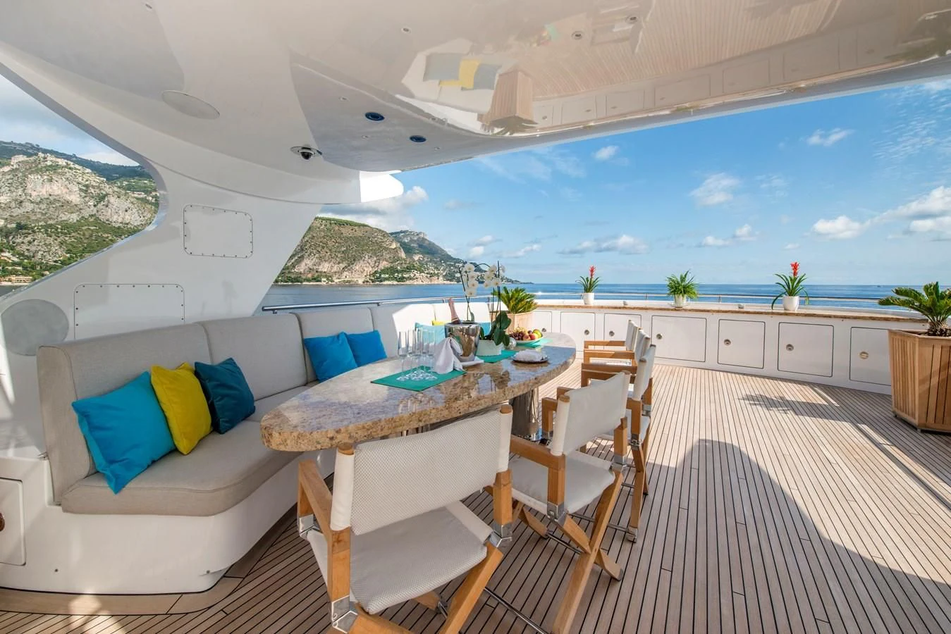 a room with a table and chairs aboard TIAMAT Yacht for Sale