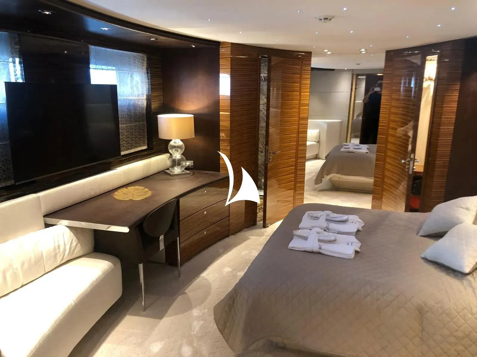 a hotel room with a bed and a tv aboard TIAMAT Yacht for Sale