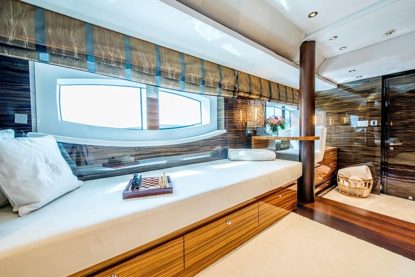 a large bed in a room aboard TIAMAT Yacht for Sale