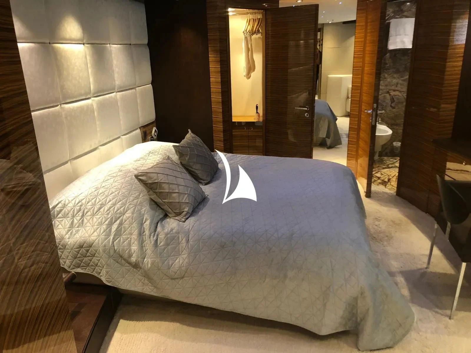 a bed in a hotel room aboard TIAMAT Yacht for Sale