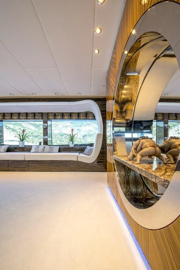 a large room with a large mirror aboard TIAMAT Yacht for Sale