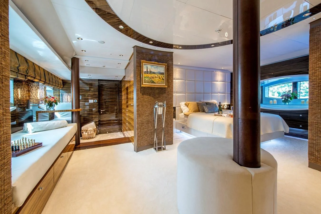 a room with a bed and a table aboard TIAMAT Yacht for Sale