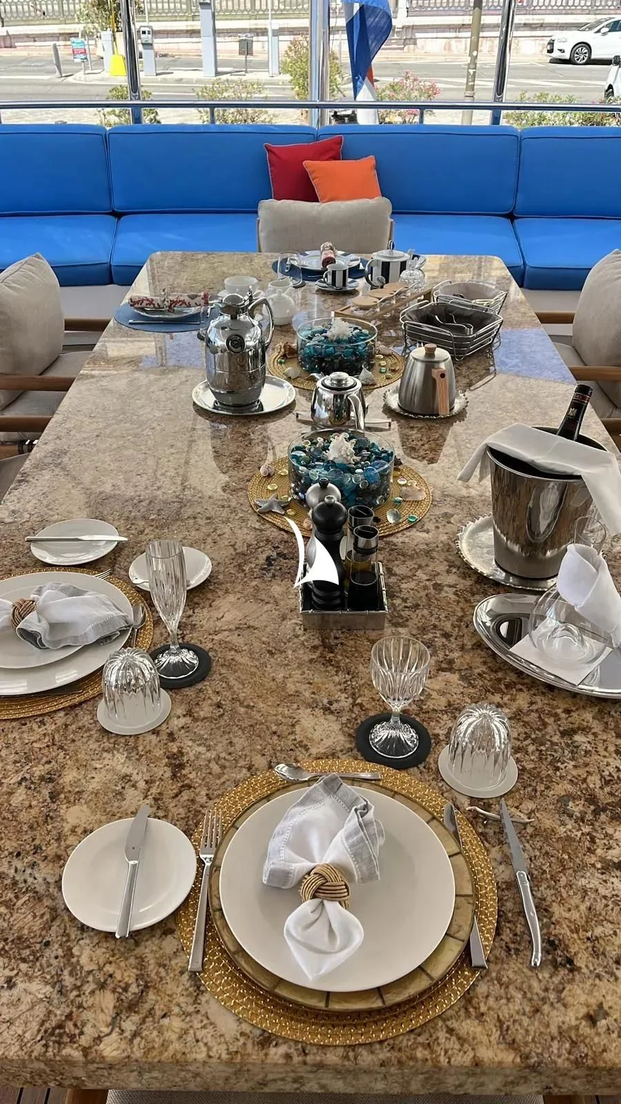 a table with plates and silverware aboard TIAMAT Yacht for Sale