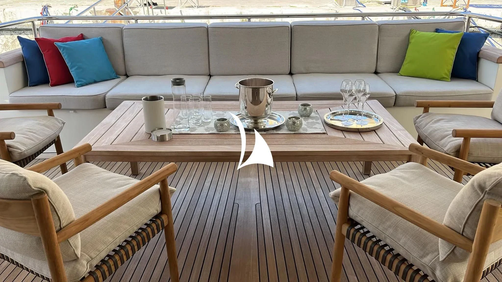 a table with a glass and a vase on it aboard TIAMAT Yacht for Sale