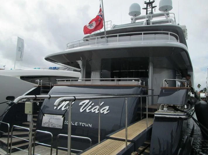 a boat with a flag on the front aboard TIAMAT Yacht for Sale