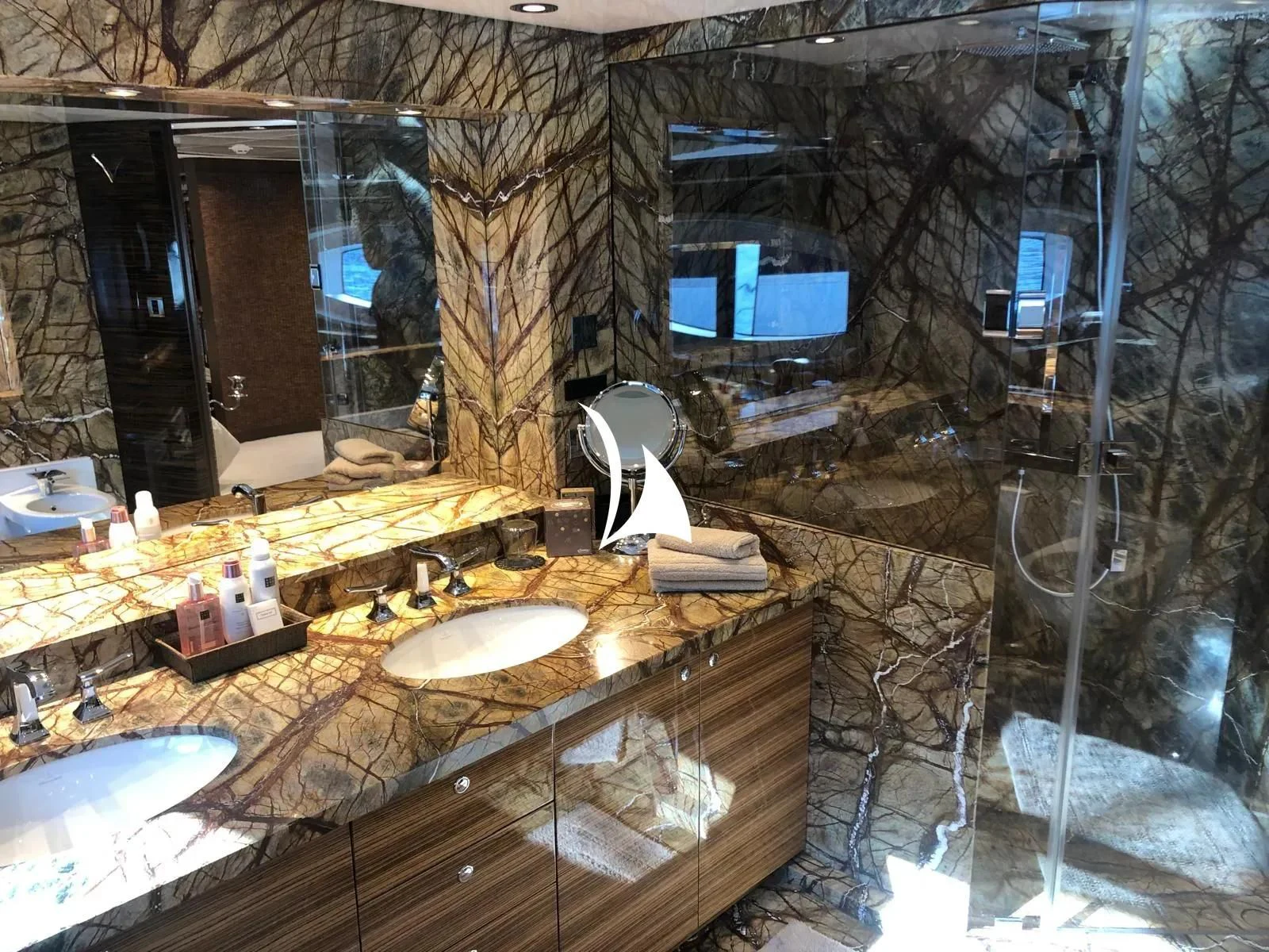 a bathroom with a large mirror aboard TIAMAT Yacht for Sale