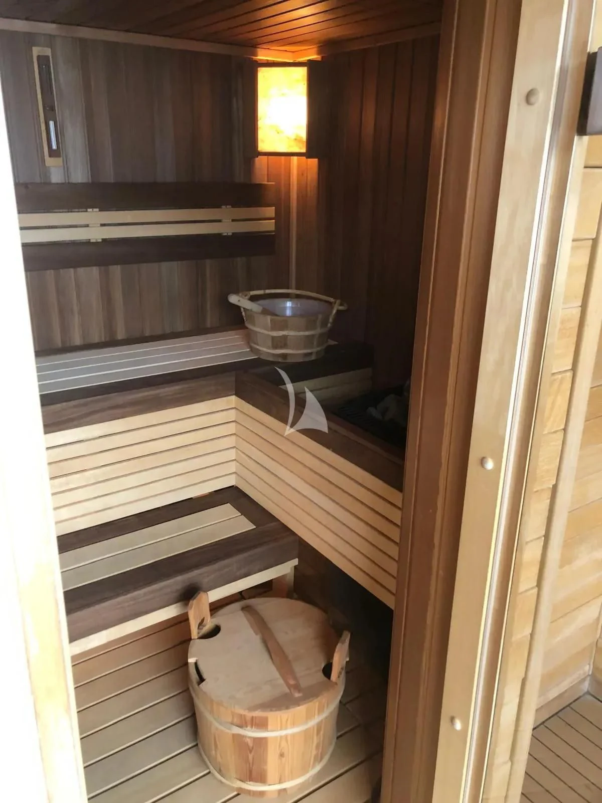 a room with a wood door and a metal bucket with a metal bucket on it aboard TIAMAT Yacht for Sale