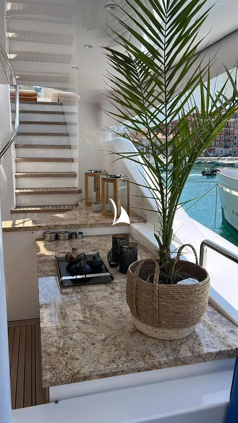 a plant in a pot on a table aboard TIAMAT Yacht for Sale