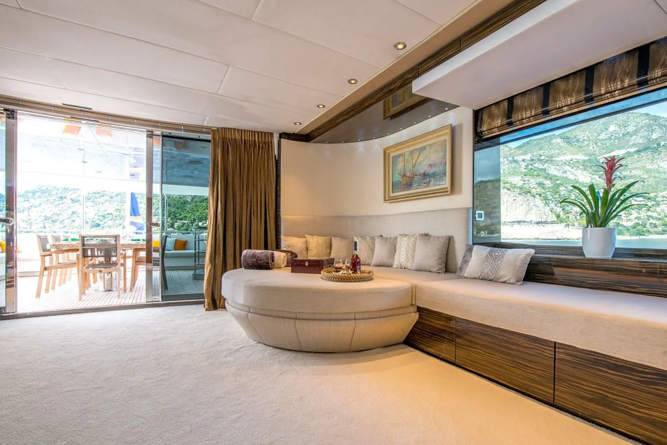 a living room with a large window aboard TIAMAT Yacht for Sale