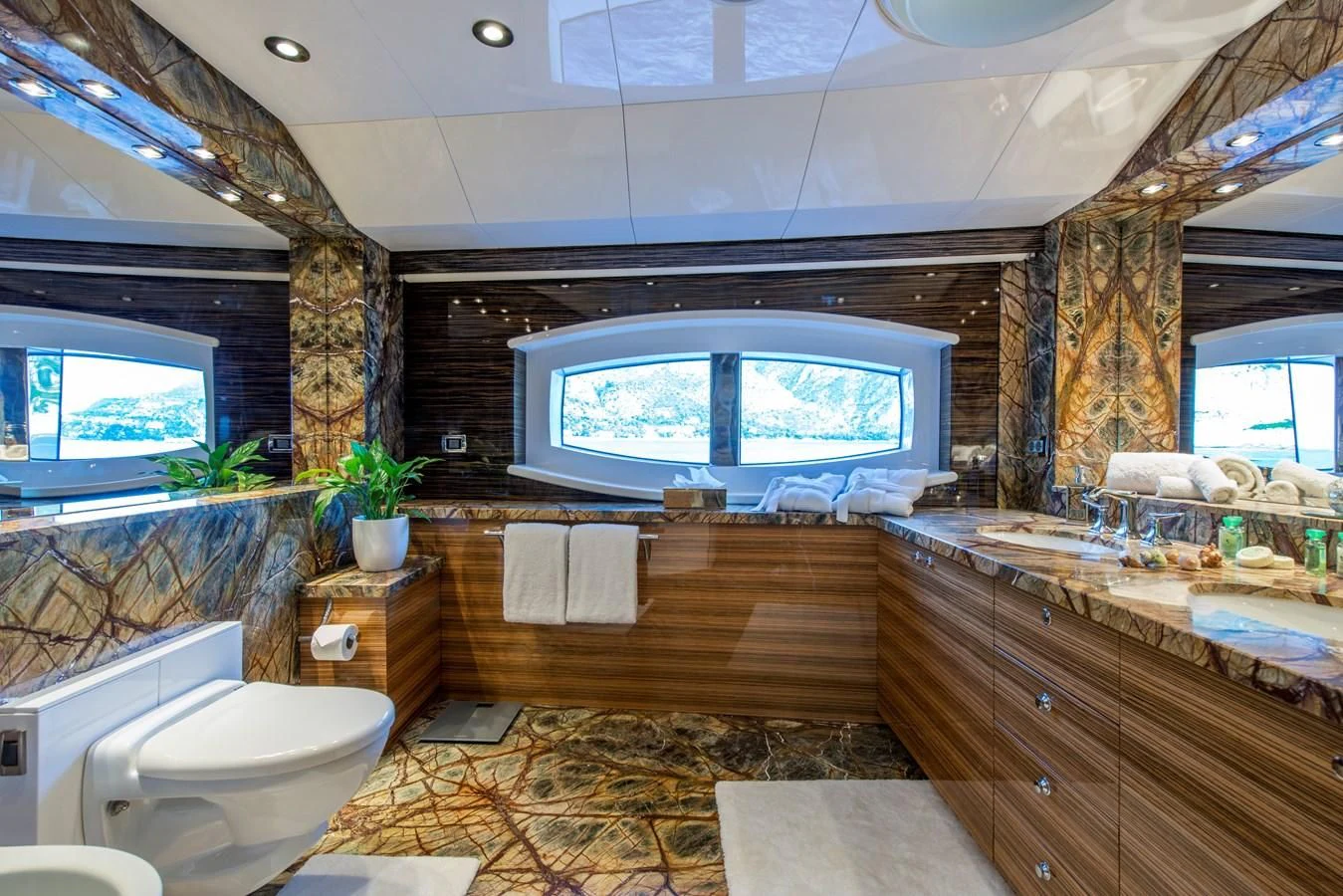 a bathroom with a large window aboard TIAMAT Yacht for Sale