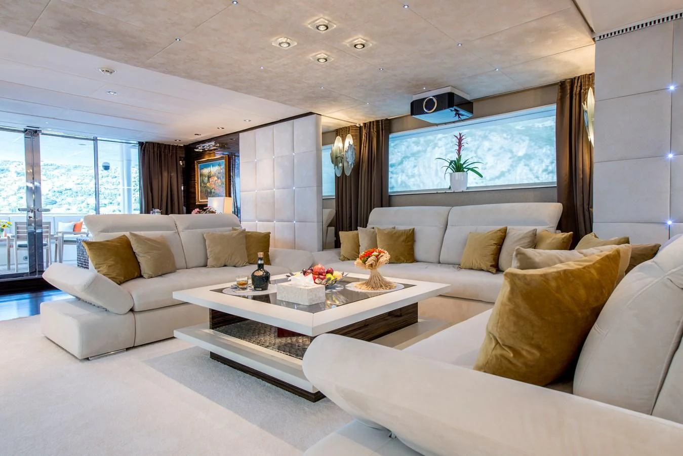 a living room with a large window aboard TIAMAT Yacht for Sale