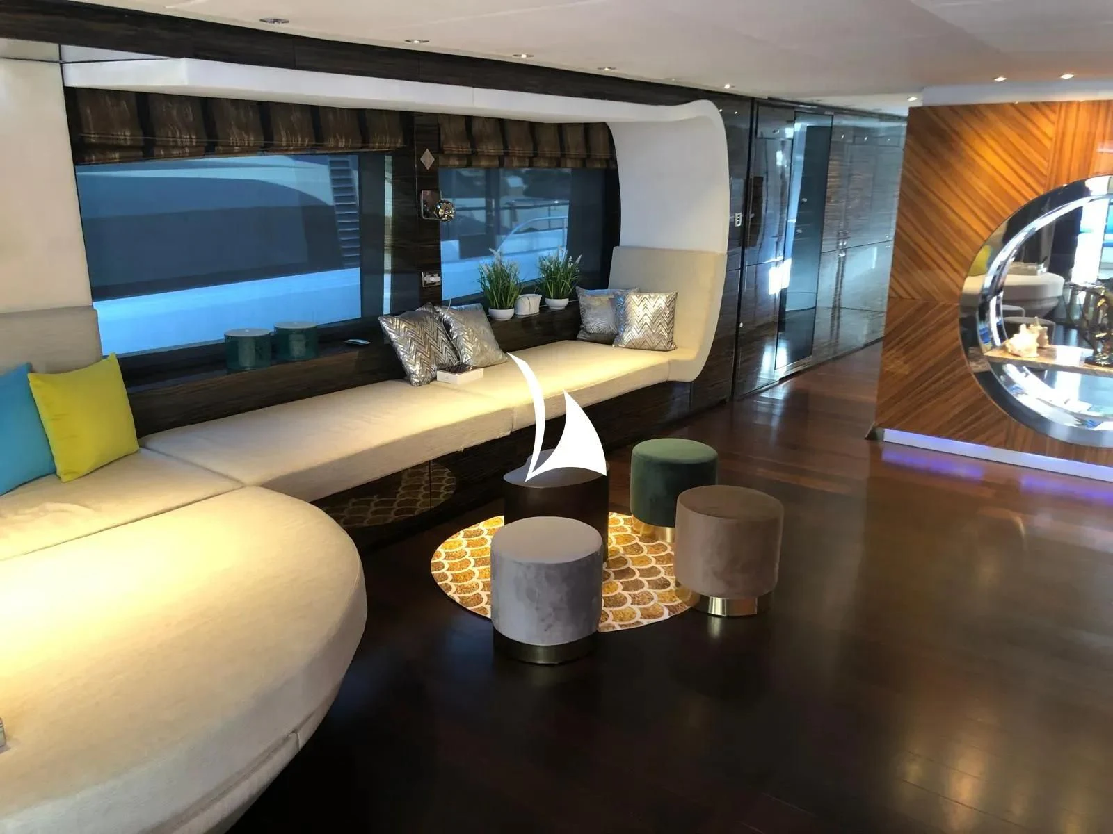 a living room with a large screen aboard TIAMAT Yacht for Sale
