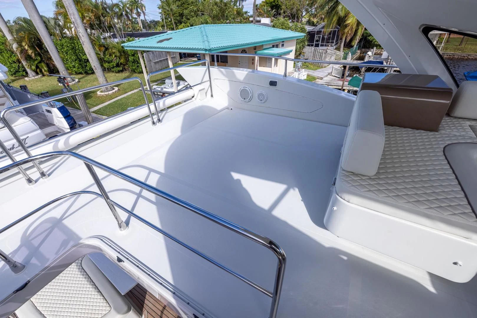 a white boat with a blue canopy aboard MEANT TO BE Yacht for Sale