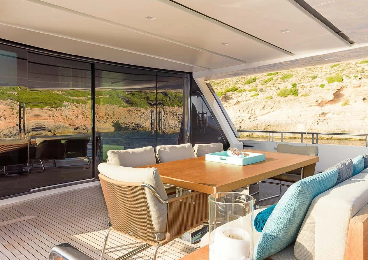 a room with a table chairs and a large window aboard MUSHA Yacht for Sale