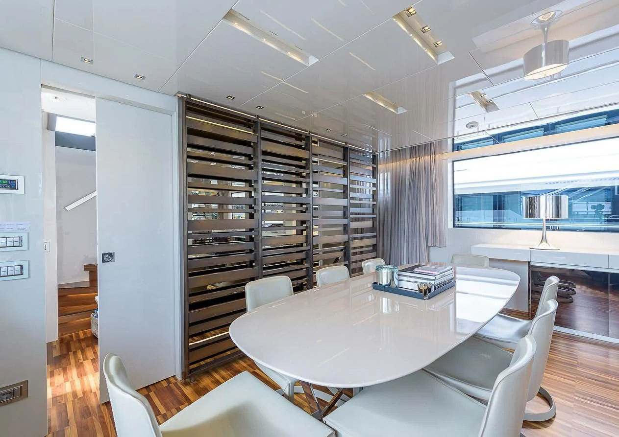 a room with a table chairs and a large window aboard MUSHA Yacht for Sale