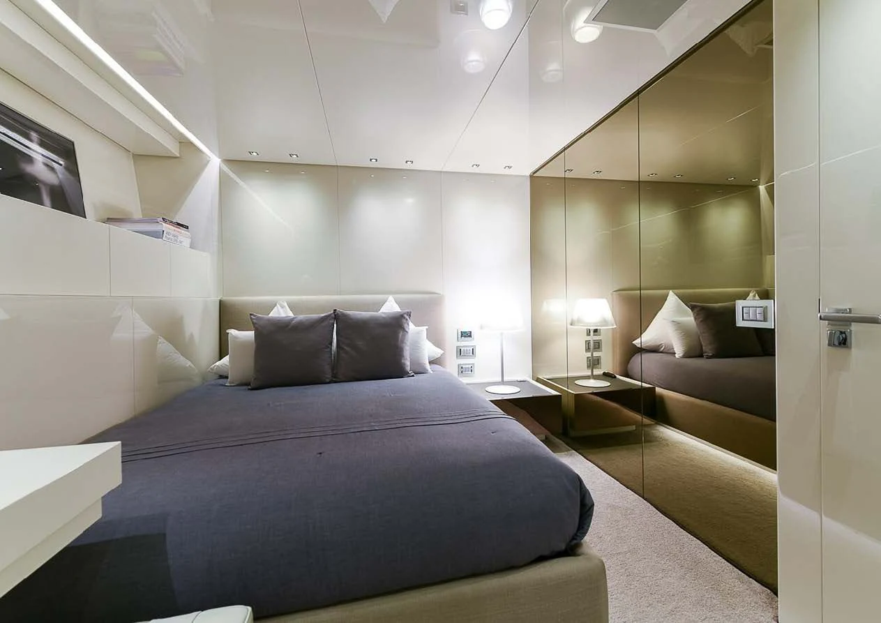 a room with a bed and a couch aboard MUSHA Yacht for Sale