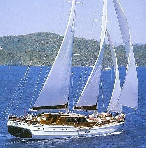 a boat sailing on the water aboard WHITE WINGS Yacht for Sale