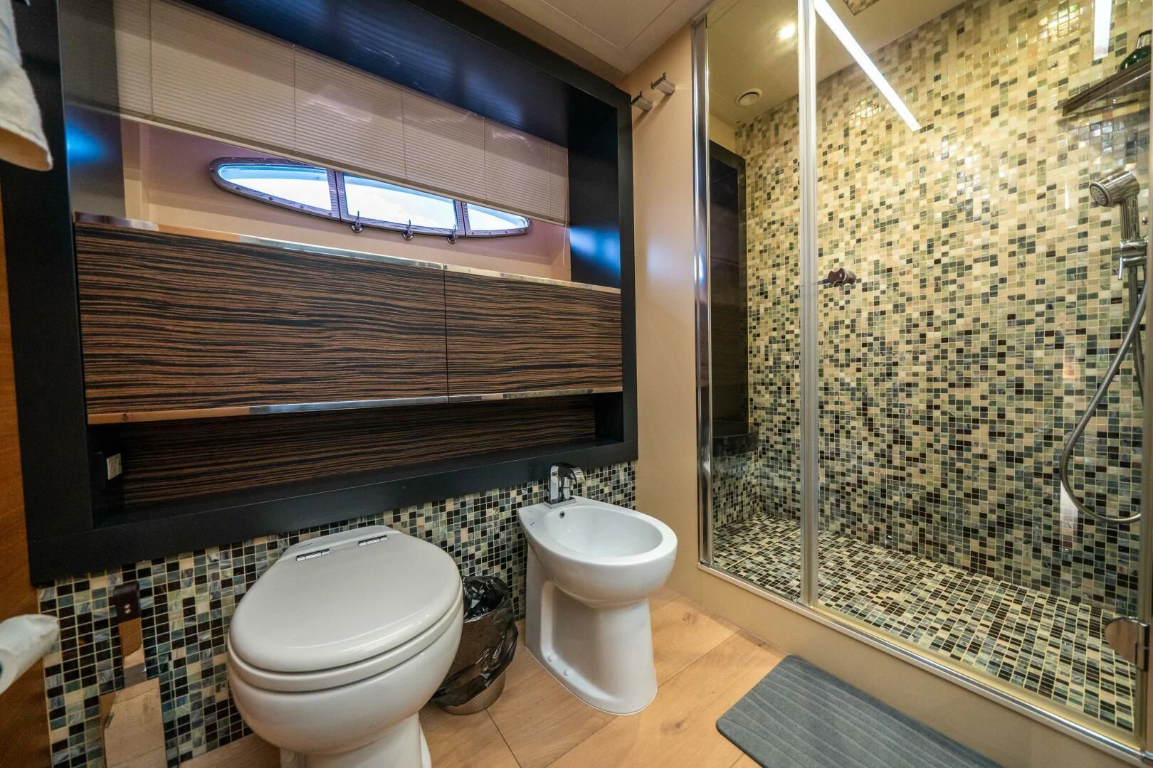 a bathroom with a glass shower aboard CERSEI Yacht for Sale