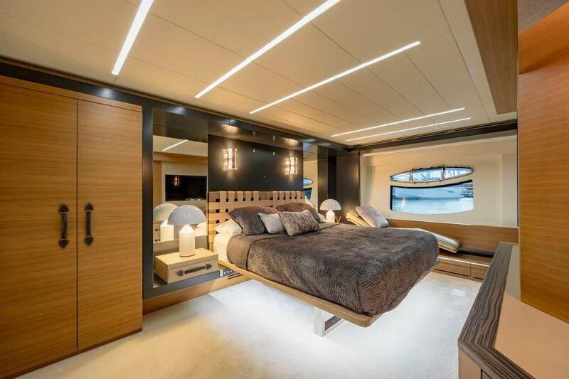 a large bedroom with a large bed aboard CERSEI Yacht for Sale