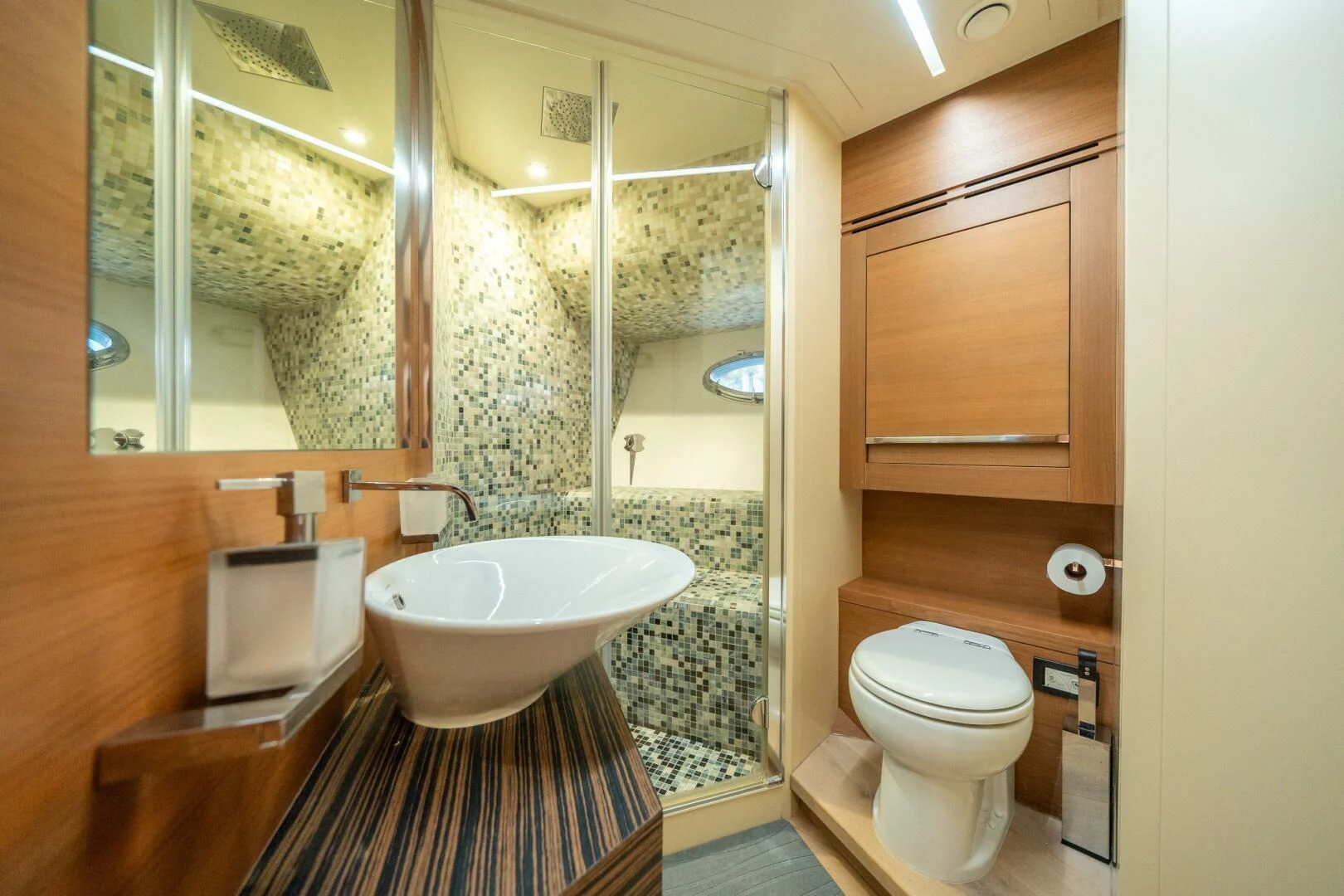 a bathroom with a glass shower aboard CERSEI Yacht for Sale