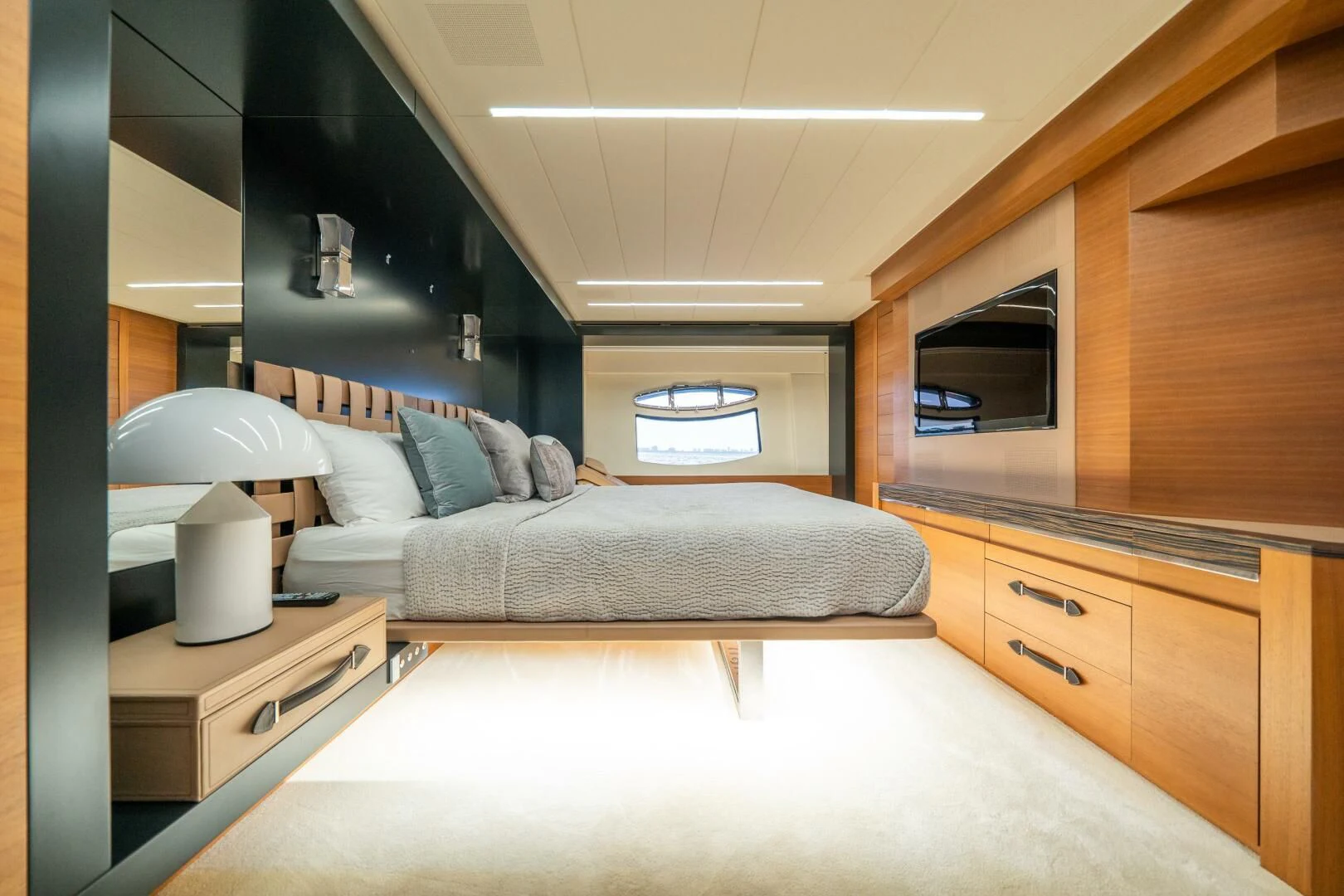 a living room with a couch and a lamp aboard CERSEI Yacht for Sale