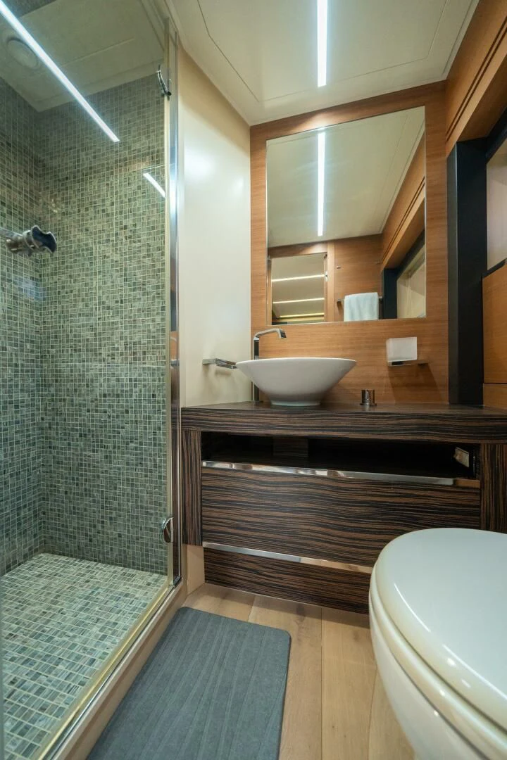 a bathroom with a glass shower aboard CERSEI Yacht for Sale