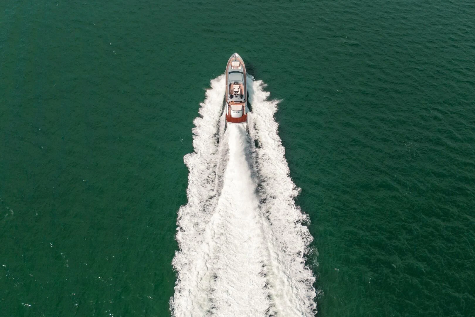 a dog in a white suit aboard CERSEI Yacht for Sale