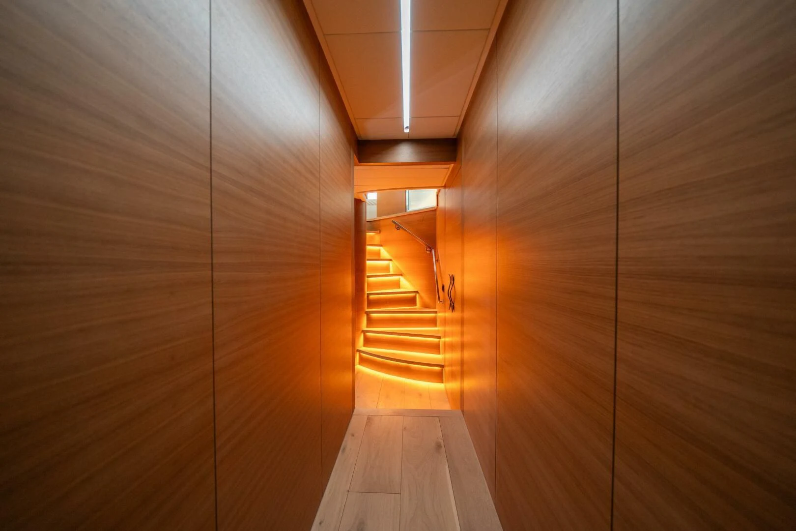 a wooden hallway with a wood floor aboard CERSEI Yacht for Sale