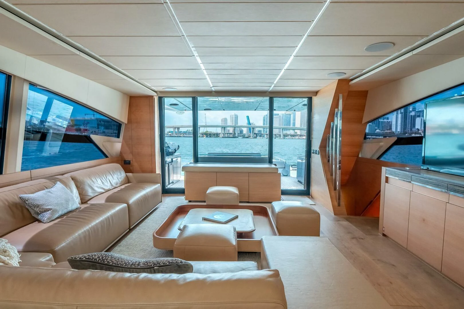 a living room with a large window aboard CERSEI Yacht for Sale