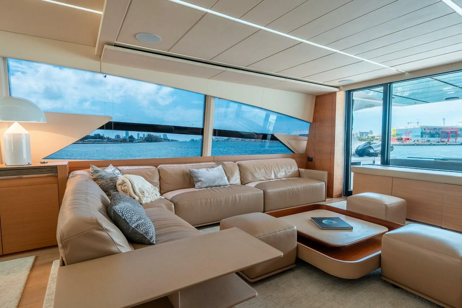 a living room with a large window aboard CERSEI Yacht for Sale