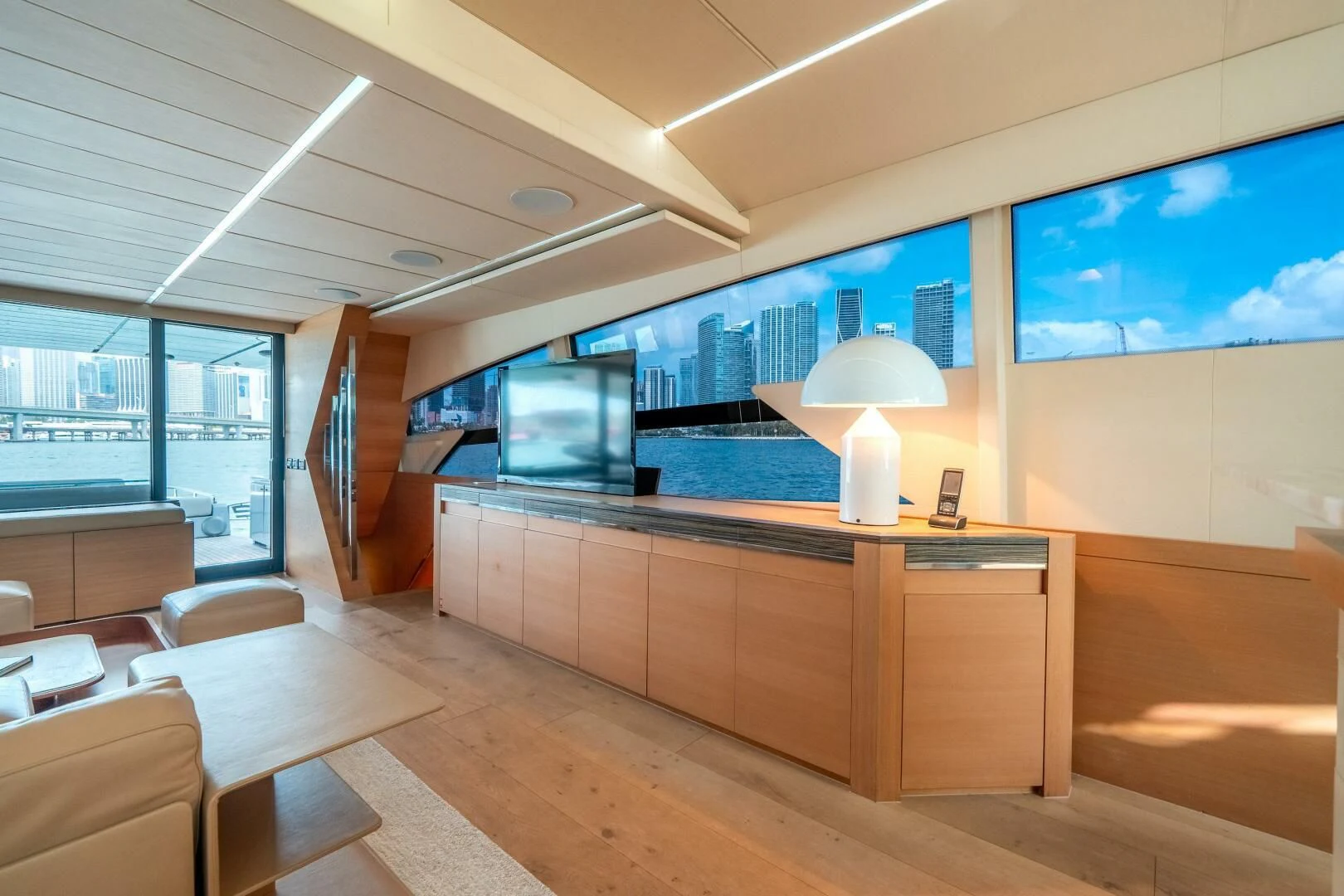a room with a desk and a large window aboard CERSEI Yacht for Sale