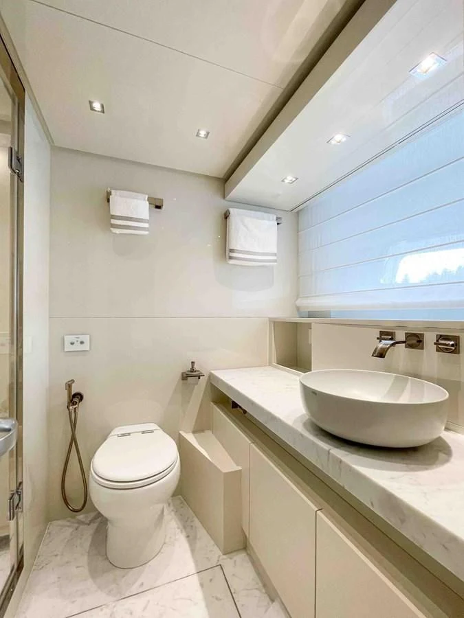 a bathroom with a sink and toilet aboard SANLORENZO SX88/81 Yacht for Sale