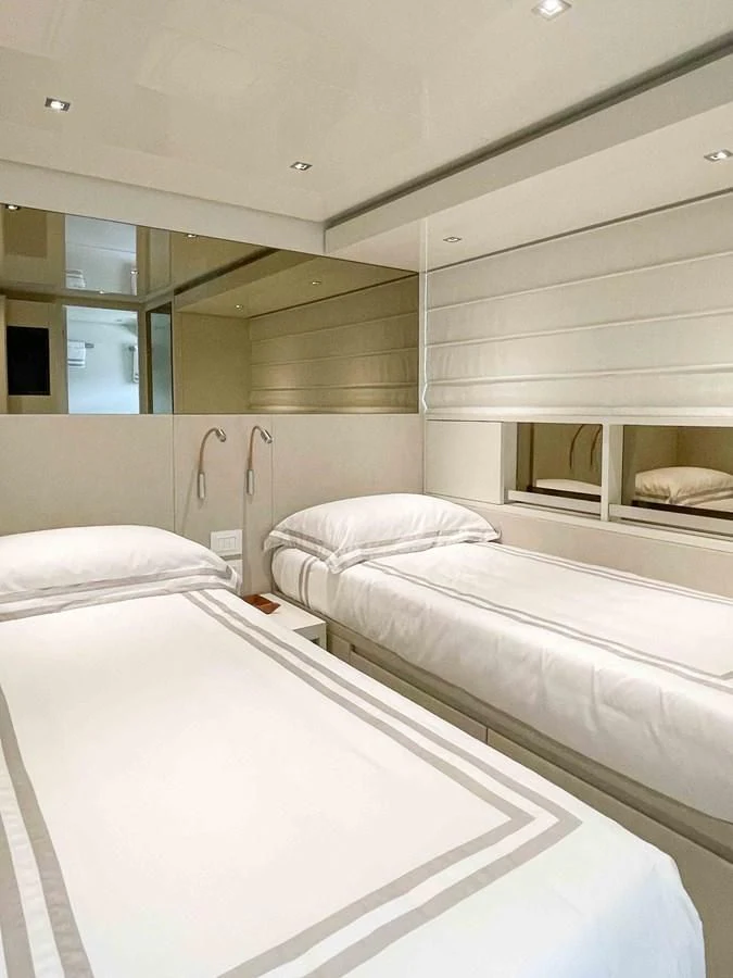 a room with white beds aboard SANLORENZO SX88/81 Yacht for Sale