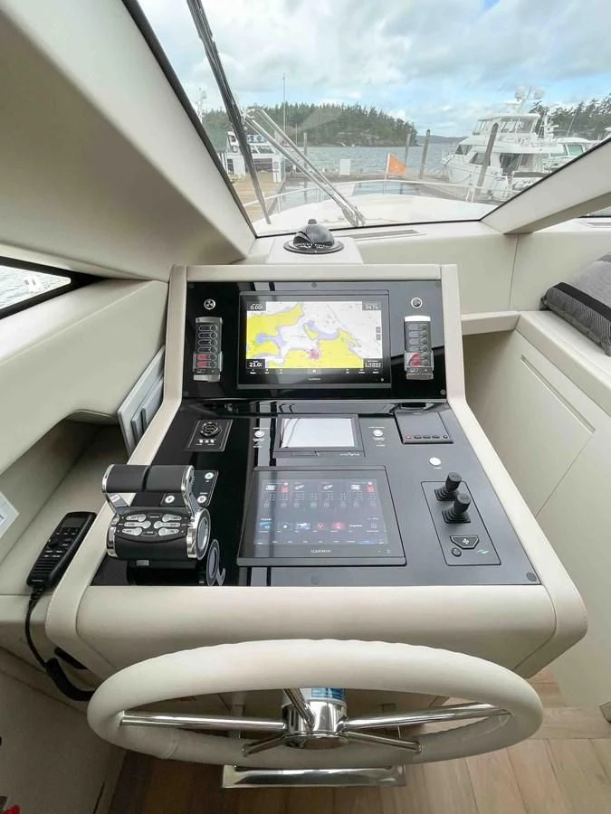 a car interior with a screen and a phone on the dashboard aboard SANLORENZO SX88/81 Yacht for Sale