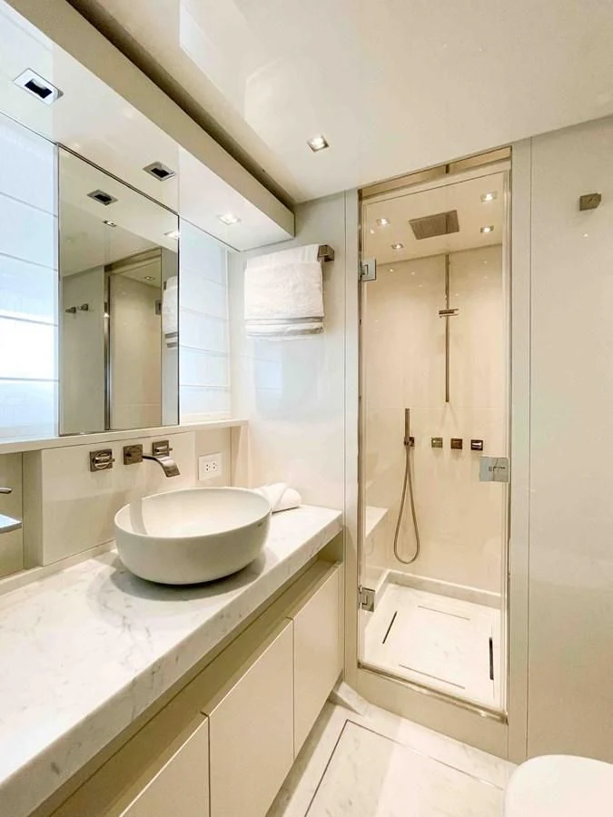 a bathroom with a sink and a mirror aboard SANLORENZO SX88/81 Yacht for Sale