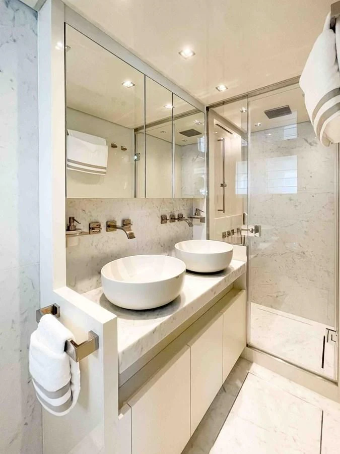 a bathroom with a sink and a mirror aboard SANLORENZO SX88/81 Yacht for Sale