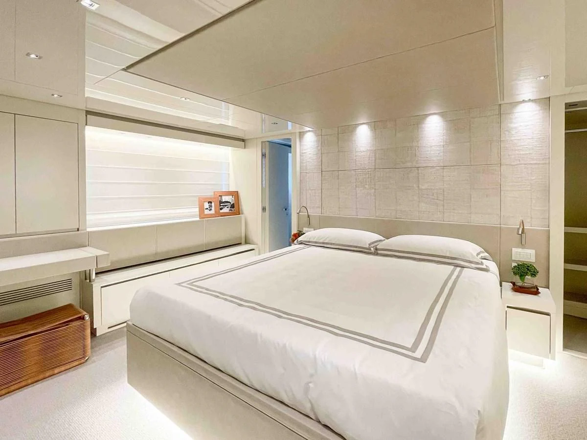a room with a bed and a window aboard SANLORENZO SX88/81 Yacht for Sale