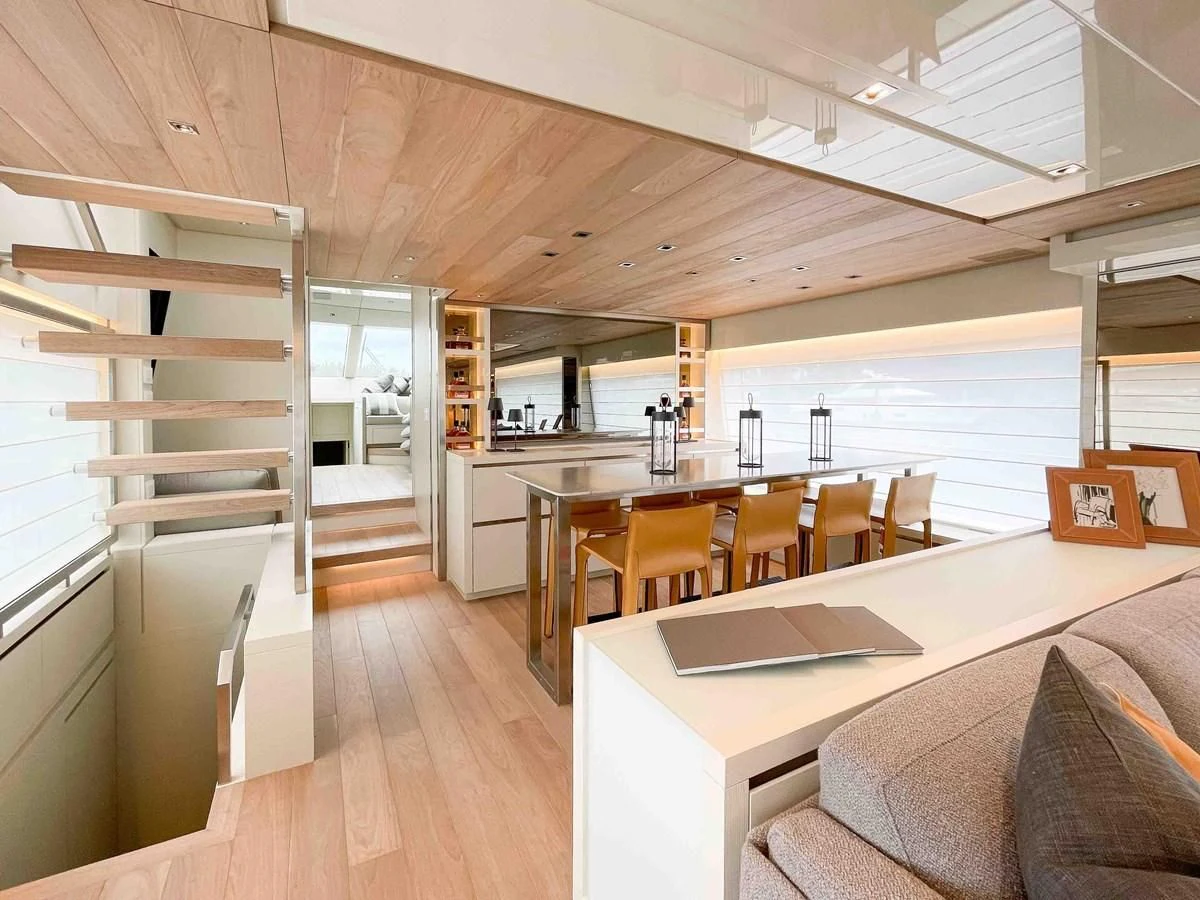 a modern looking kitchen with a large open shelving unit aboard SANLORENZO SX88/81 Yacht for Sale