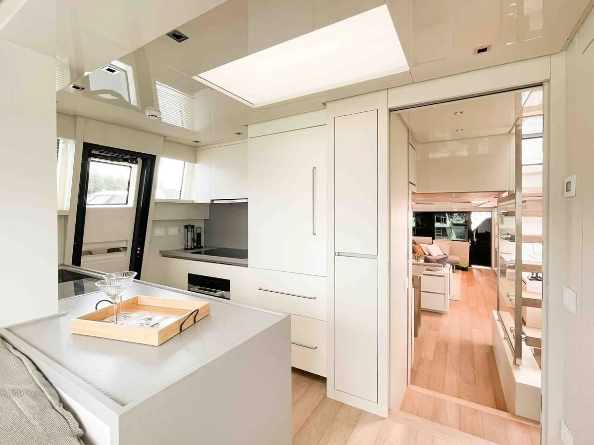a kitchen with a table and a microwave aboard SANLORENZO SX88/81 Yacht for Sale