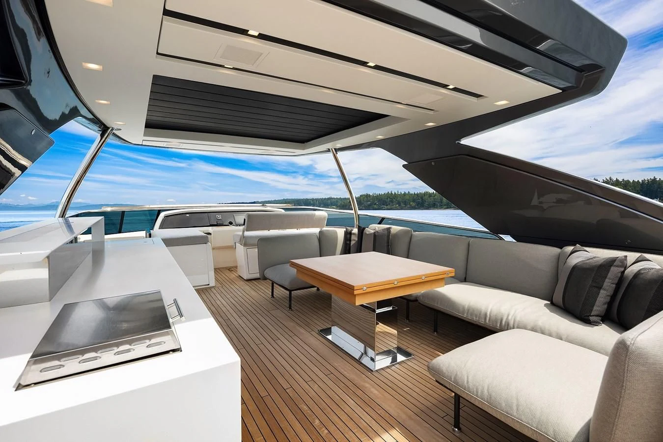 a room with a couch and a table and a pool aboard SANLORENZO SX88/81 Yacht for Sale