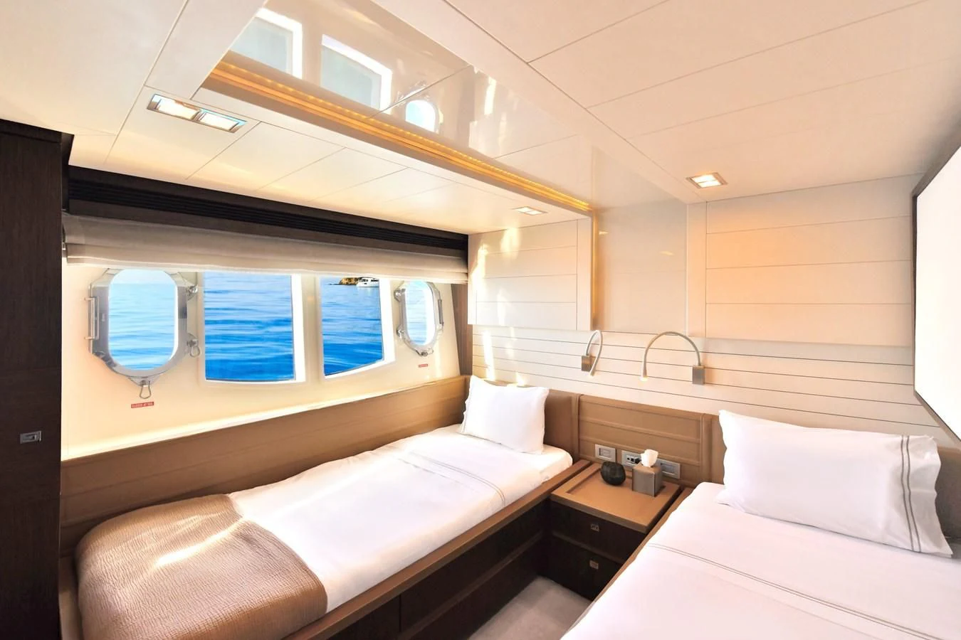 a room with two beds aboard CUSTOM LINE 100 Yacht for Sale