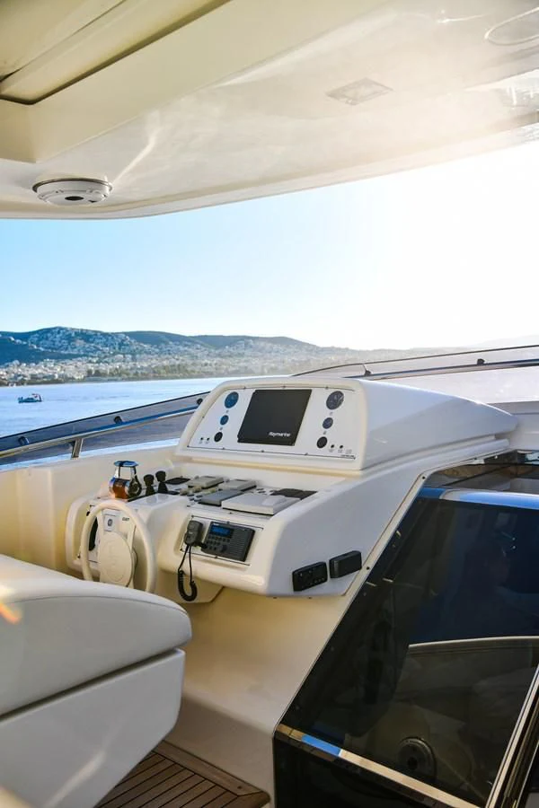 a white machine on a boat aboard CUSTOM LINE 100 Yacht for Sale