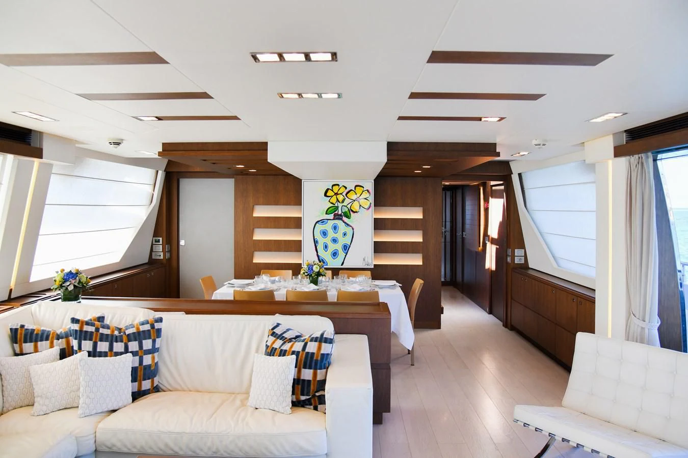 a living room with a couch and a table aboard CUSTOM LINE 100 Yacht for Sale