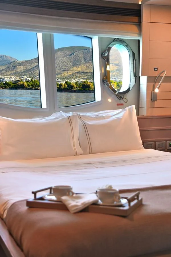 a bed with a large mirror above it aboard CUSTOM LINE 100 Yacht for Sale